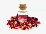 rose-essential-oil-in-glass-bottle-with-dried-rose-flower-buds